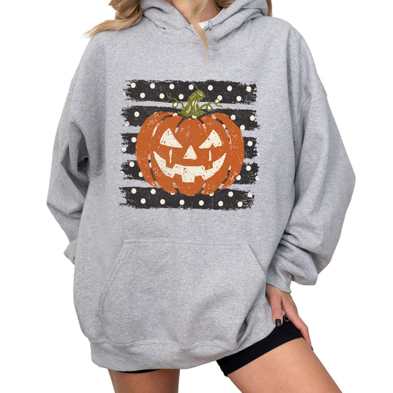 Gray hoodie with retro polka dot jack o lantern pumpkin graphic, detail shot