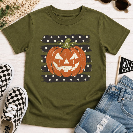 Retro jack-o-lantern pumpkin polka dot Halloween kids tee in Military Green, styled view