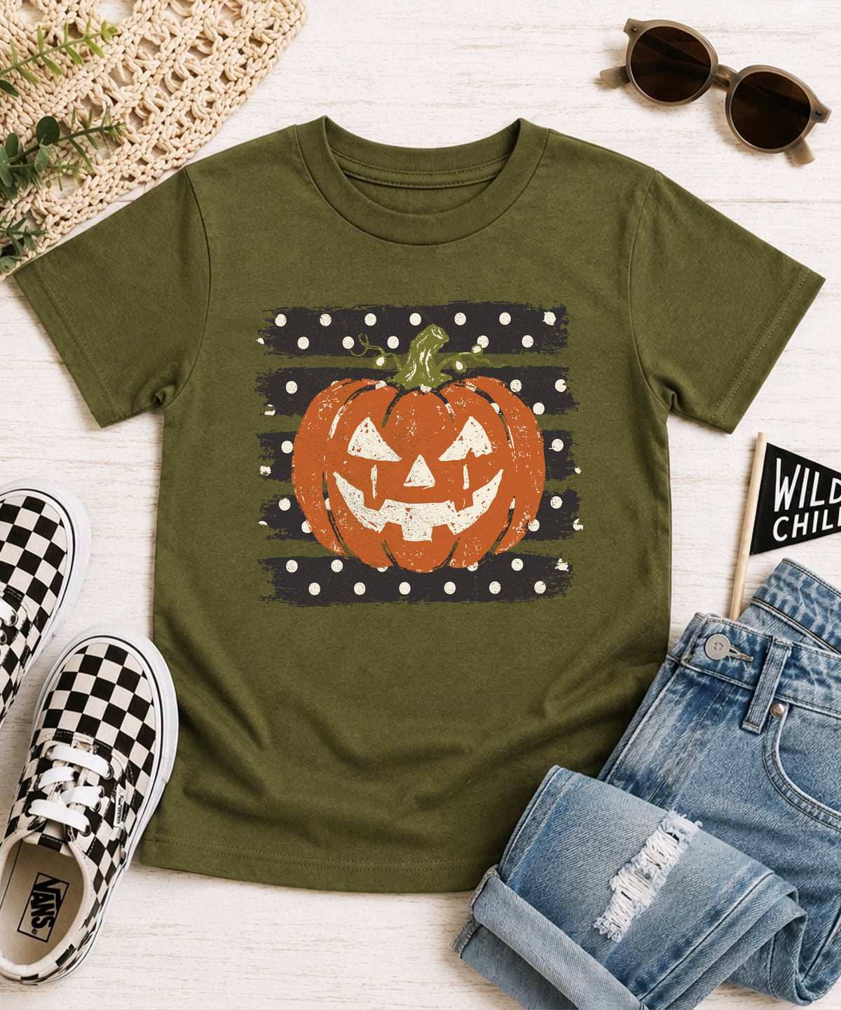 Retro jack-o-lantern pumpkin polka dot Halloween kids tee in Military Green, styled view