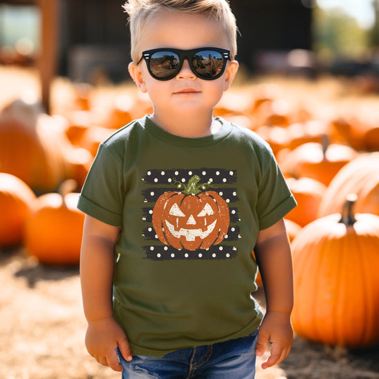 Retro jack-o-lantern pumpkin polka dot Halloween kids tee in Military Green, close-up print detail