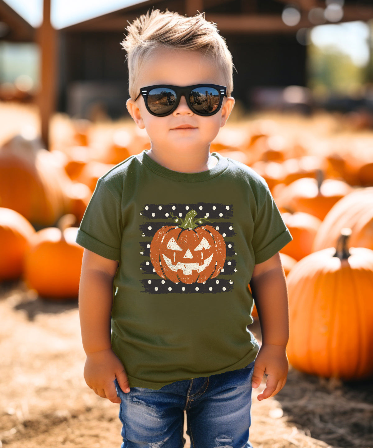 Retro jack-o-lantern pumpkin polka dot Halloween kids tee in Military Green, close-up print detail
