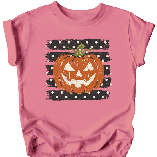 Retro jack-o-lantern pumpkin polka dot Halloween kids tee in Mauve, front view