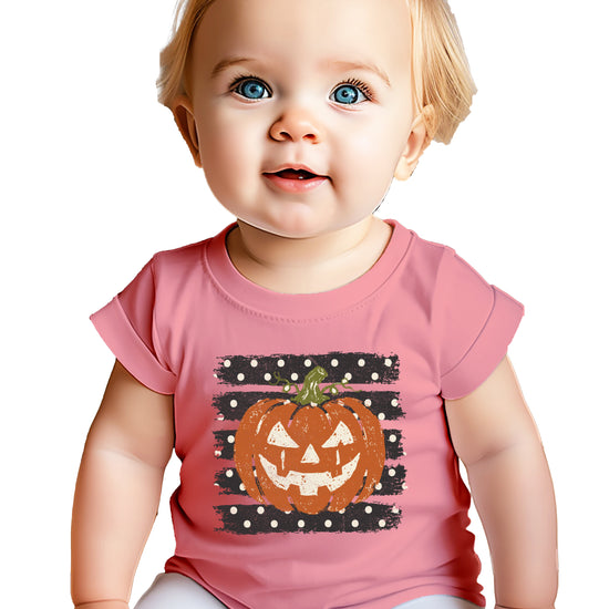 Retro jack-o-lantern pumpkin polka dot Halloween kids tee in Mauve, flat lay view