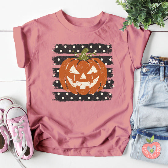 Retro jack-o-lantern pumpkin polka dot Halloween kids tee in Mauve, styled view