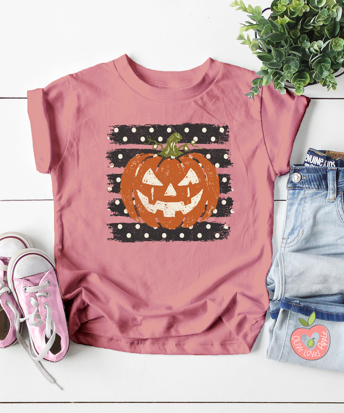 Retro jack-o-lantern pumpkin polka dot Halloween kids tee in Mauve, styled view
