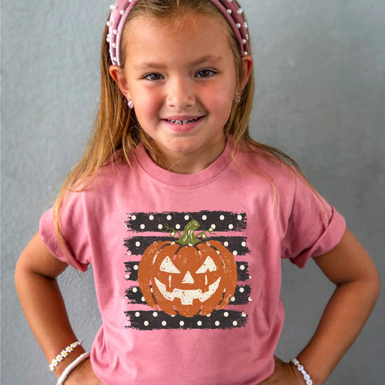 Retro jack-o-lantern pumpkin polka dot Halloween kids tee in Mauve, close-up print detail