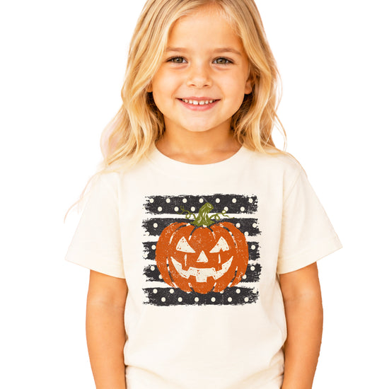 Retro jack-o-lantern pumpkin polka dot Halloween kids tee in Natural, detail view of the pumpkin graphic