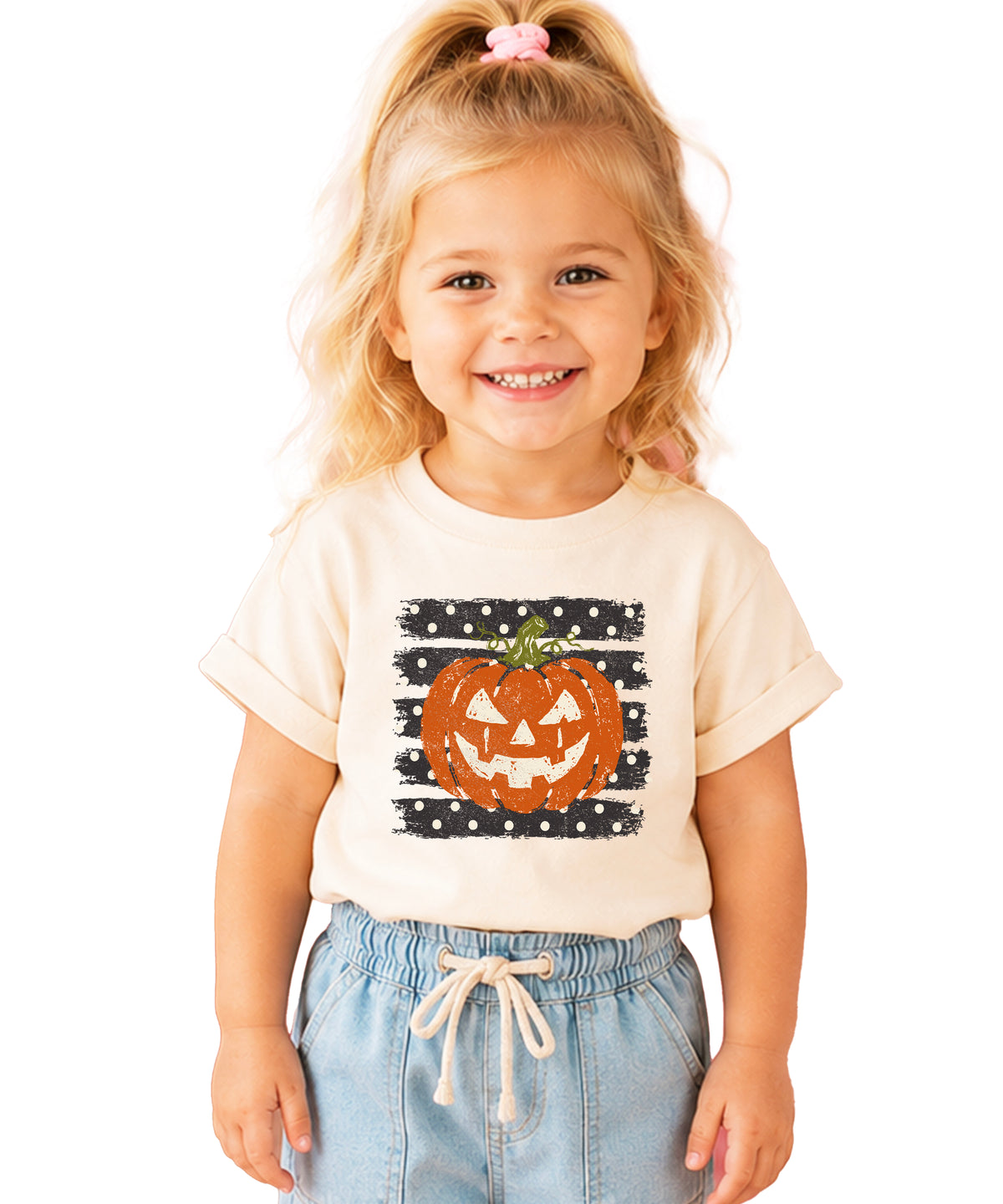 Retro jack-o-lantern pumpkin polka dot Halloween kids tee in Natural, flat lay view