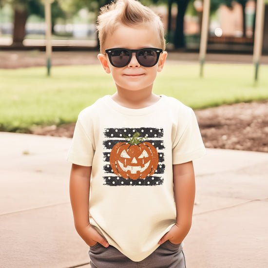 Retro jack-o-lantern pumpkin polka dot Halloween kids tee in Natural, close-up print detail