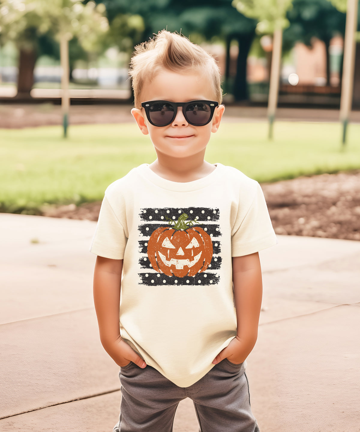 Retro jack-o-lantern pumpkin polka dot Halloween kids tee in Natural, close-up print detail