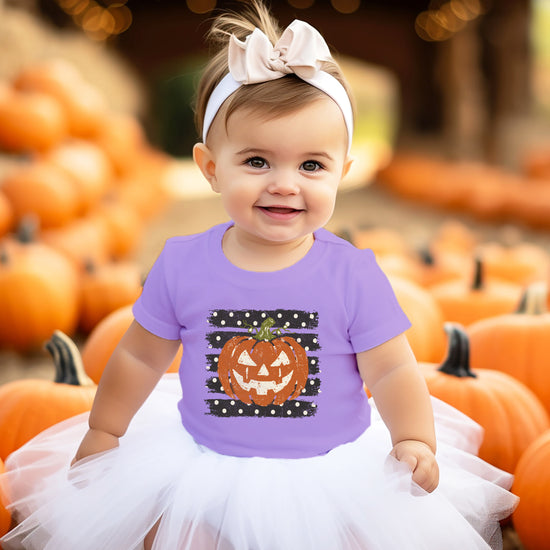 Retro jack-o-lantern pumpkin polka dot Halloween kids tee in Purple, lifestyle view