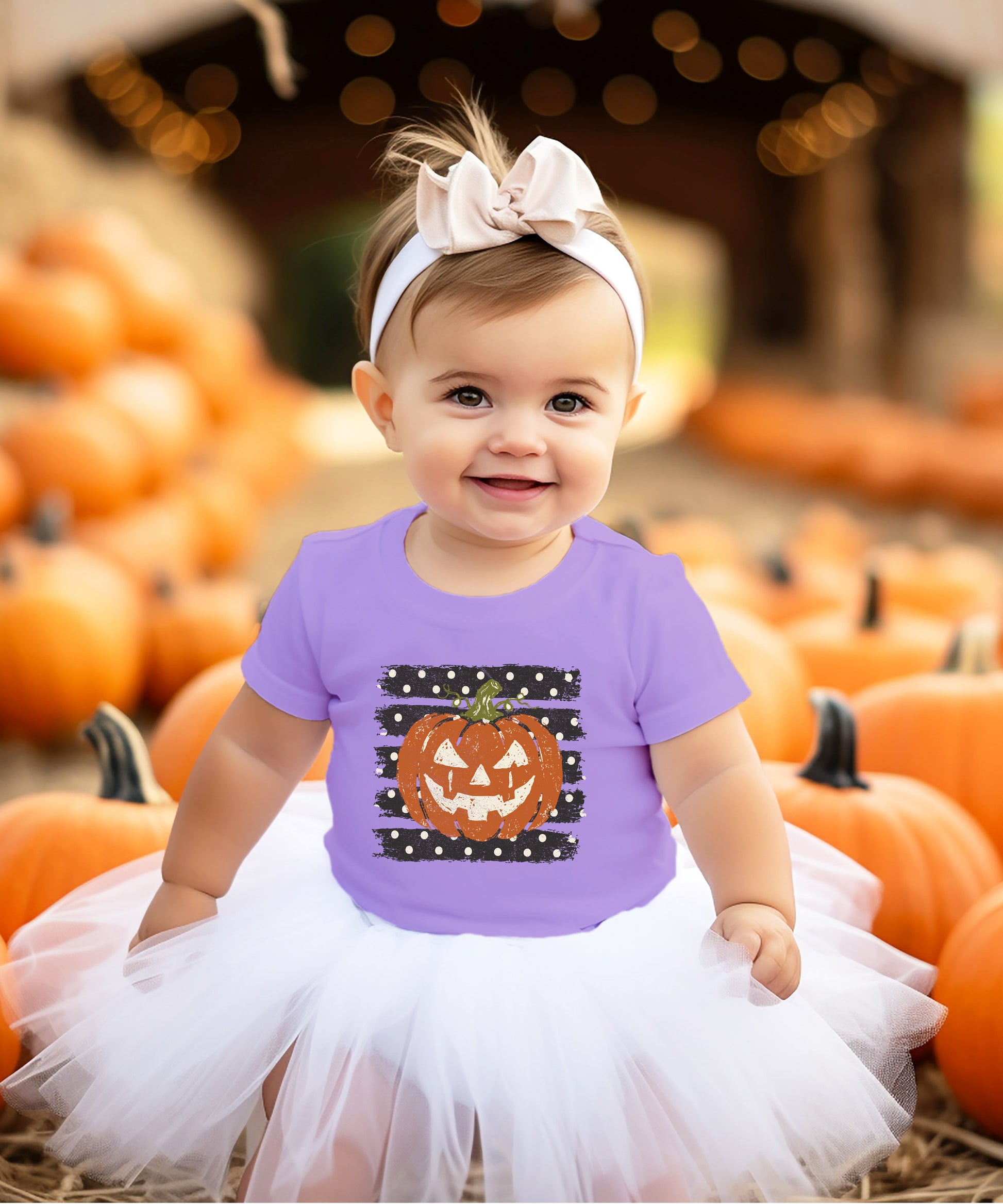 Retro jack-o-lantern pumpkin polka dot Halloween kids tee in Purple, lifestyle view