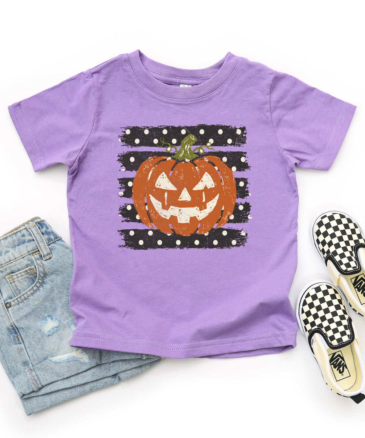 Retro jack-o-lantern pumpkin polka dot Halloween kids tee in Purple, styled view