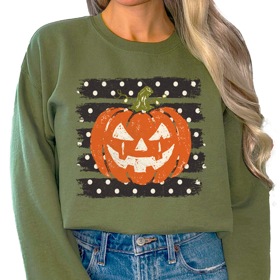 Jack-o-lantern pumpkin polka dot Halloween crewneck sweatshirt in Army Green, lifestyle view