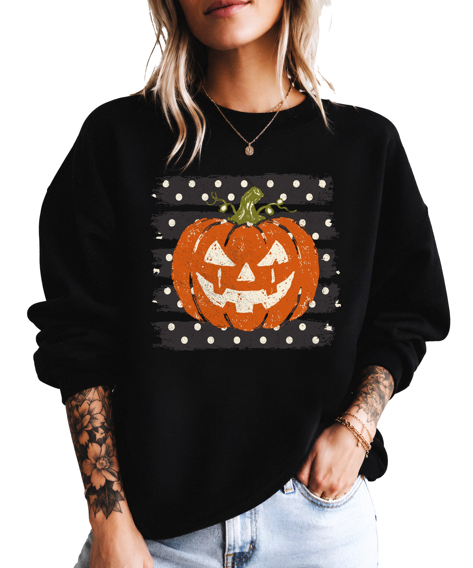 Jack-o-lantern pumpkin polka dot Halloween crewneck sweatshirt in Black, front view