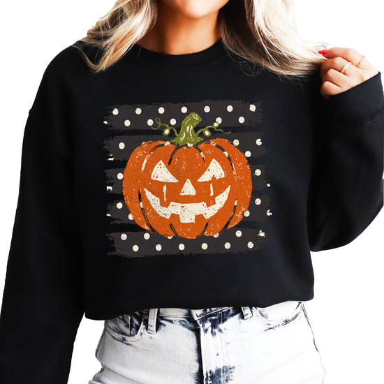 Jack-o-lantern pumpkin polka dot Halloween crewneck sweatshirt in Black, lifestyle view