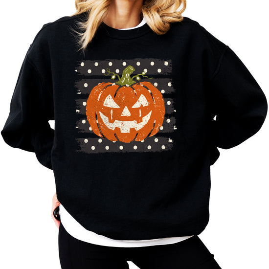 Jack-o-lantern pumpkin polka dot Halloween crewneck sweatshirt in Black, flat lay view