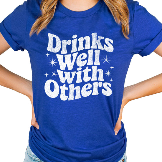 Drinks Well With Others funny graphic tee for women in Vintage Royal, detail view