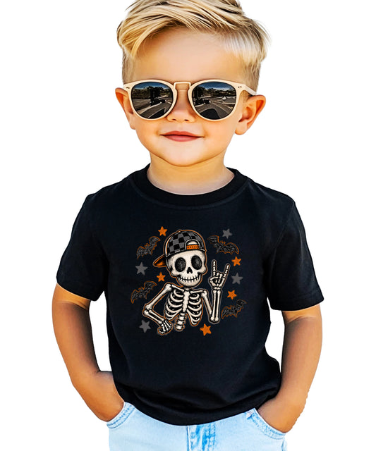 Black skeleton Halloween shirt for boys with rock on hand sign and checkered hat, front view