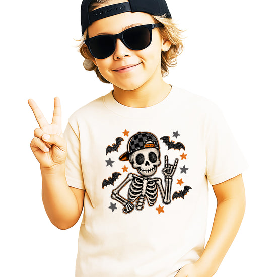 Natural skeleton Halloween shirt for boys with rock on hand sign and checkered hat, front view