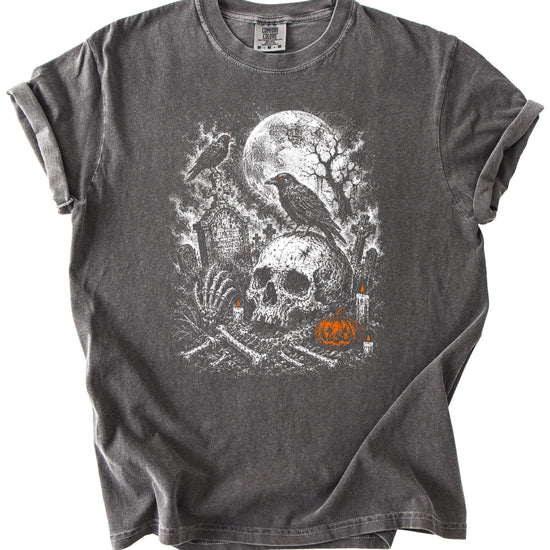 Halloween skull cemetery graphic tee in Pepper, close up of moonlit graveyard and jack-o-lantern artwork