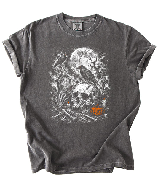 Halloween skull cemetery graphic tee in Pepper, close up of moonlit graveyard and jack-o-lantern artwork