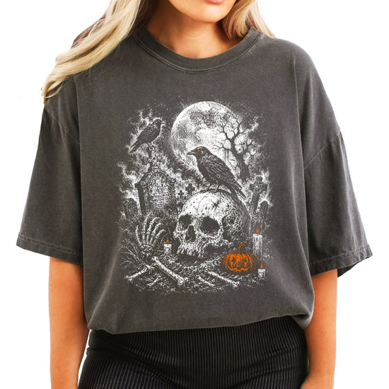 Spooky crow and headstones Halloween tee in Pepper, styled flat lay for fall