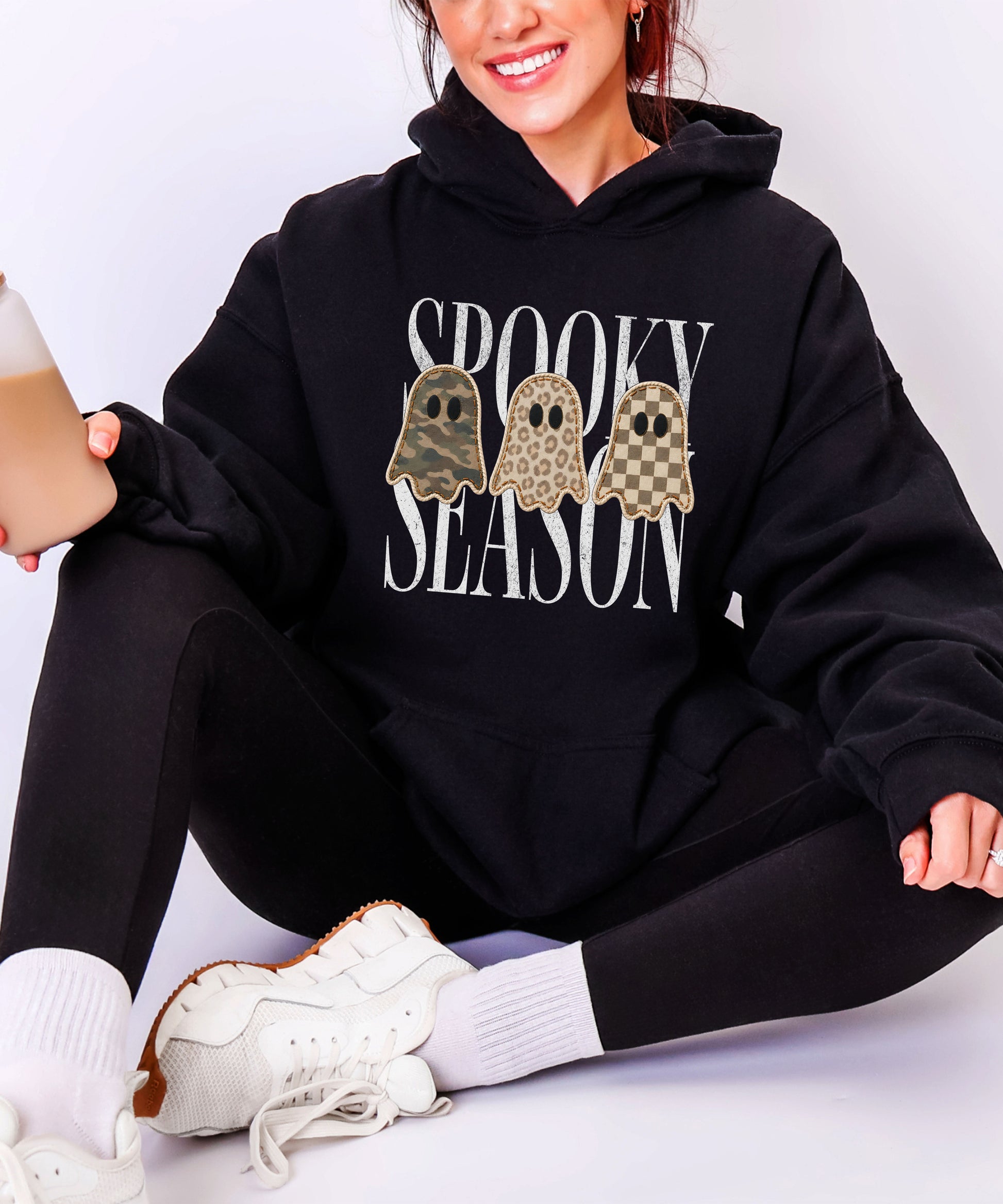 Black hoodie with Spooky Season three ghosts Halloween graphic