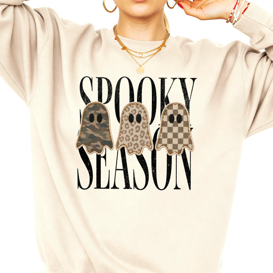 Sand Halloween ghost crewneck sweatshirt, close up of camo leopard checkered ghosts