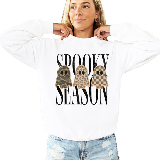 White Halloween ghost crewneck sweatshirt, close up of camo leopard checkered ghosts