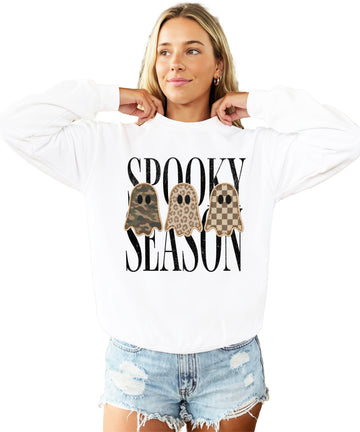 White Halloween ghost crewneck sweatshirt, close up of camo leopard checkered ghosts