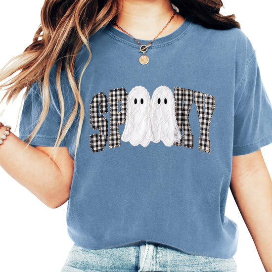 Ink-printed spooky ghost Halloween shirt with arched SPOOKY varsity lettering in black and white gingham and two lace-look ghosts, on a Blue Jean Comfort Colors 1717 tee, view 1