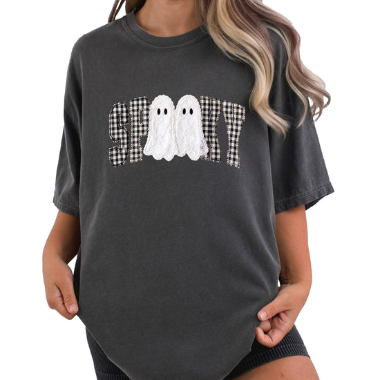 Ink-printed spooky ghost Halloween shirt with arched SPOOKY varsity lettering in black and white gingham and two lace-look ghosts, on a Pepper Comfort Colors 1717 tee, view 1