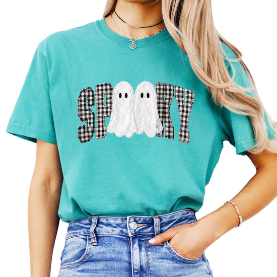 Ink-printed spooky ghost Halloween shirt with arched SPOOKY varsity lettering in black and white gingham and two lace-look ghosts, on a Seafoam Comfort Colors 1717 tee, view 1