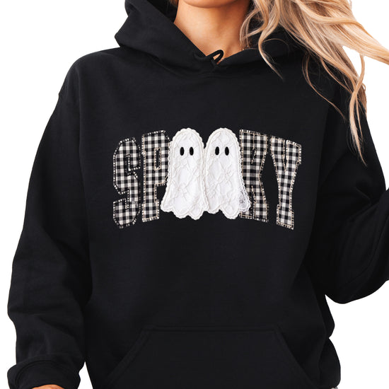 Black spooky ghost gingham hoodie shown on a model, front view
