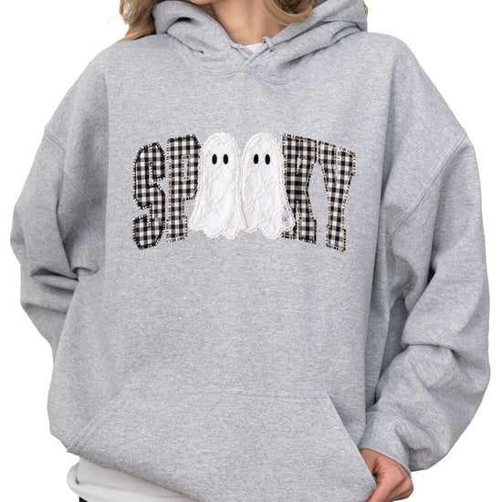 Gray spooky ghost gingham hoodie shown on a model, front view