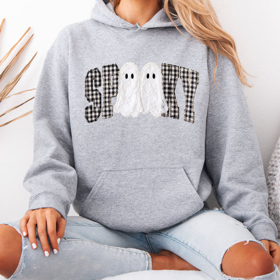 Gray spooky ghost gingham hoodie close-up of the printed graphic