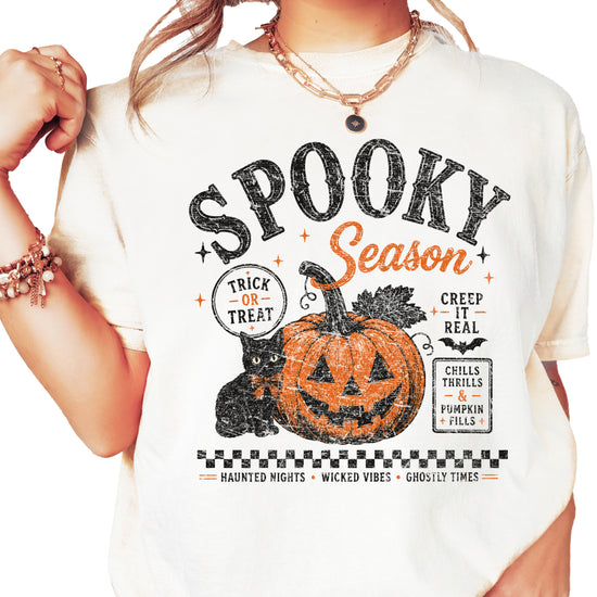 Spooky Season vintage Halloween pumpkin and black cat graphic tee in Ivory, front view