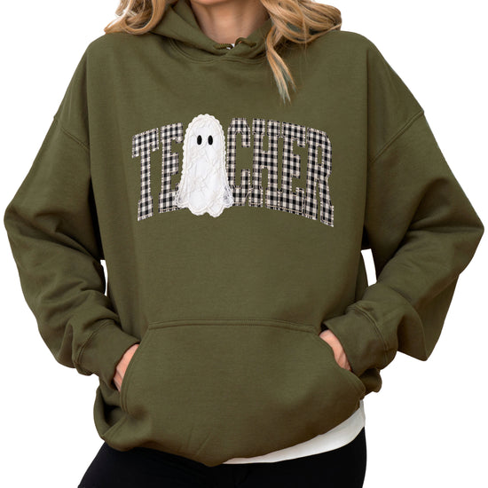 Army green hoodie with ink-printed gingham ghost teacher Halloween graphic, front view