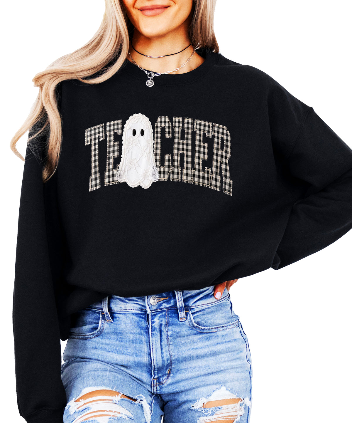 Black crewneck sweatshirt with ink-printed gingham checkered TEACHER lettering and lace-look ghost, front view