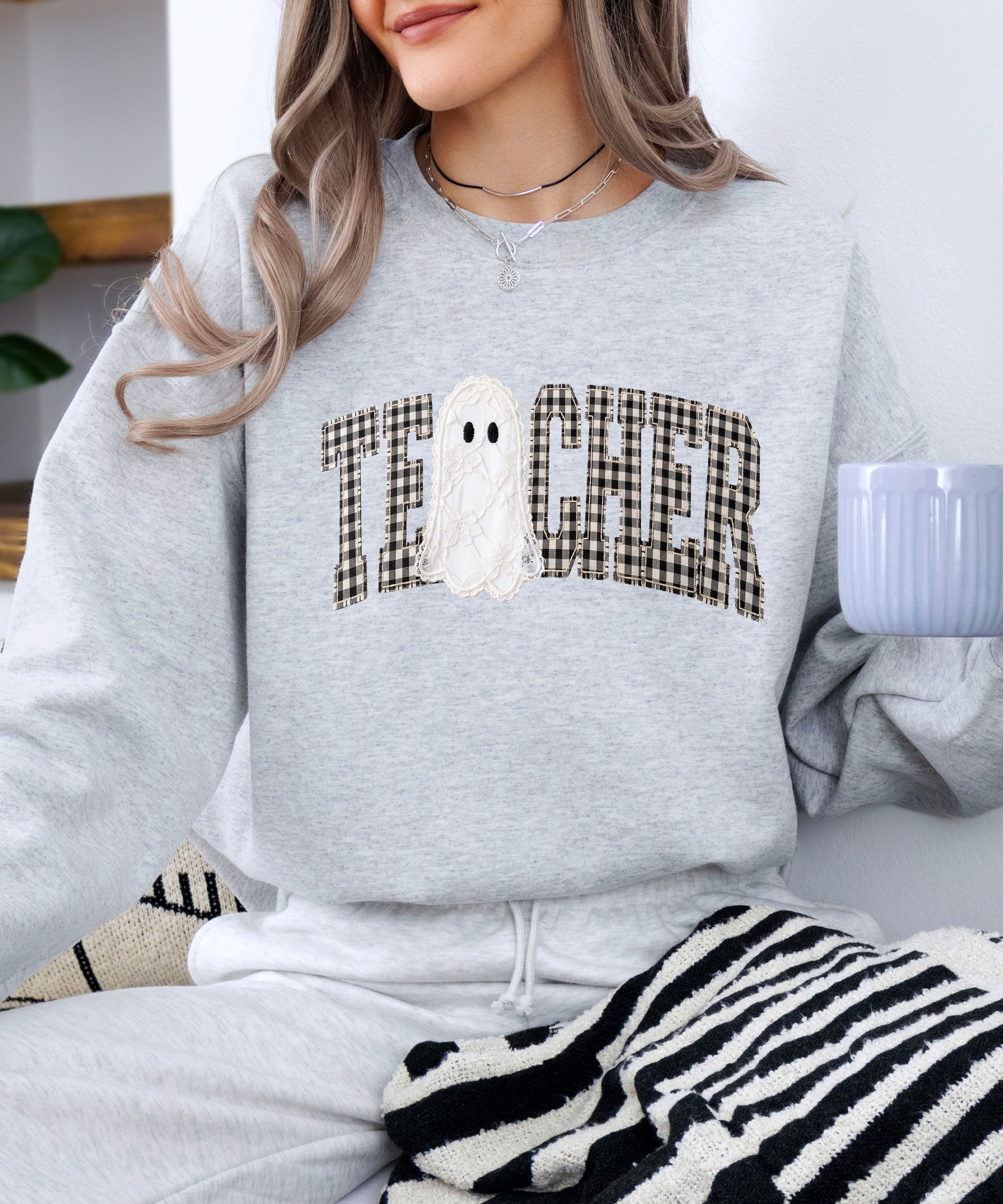Gray teacher Halloween crewneck sweatshirt detail view