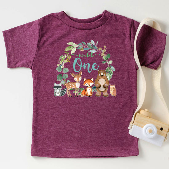 Vintage burgundy Wild One wreath first birthday tee flat lay front view