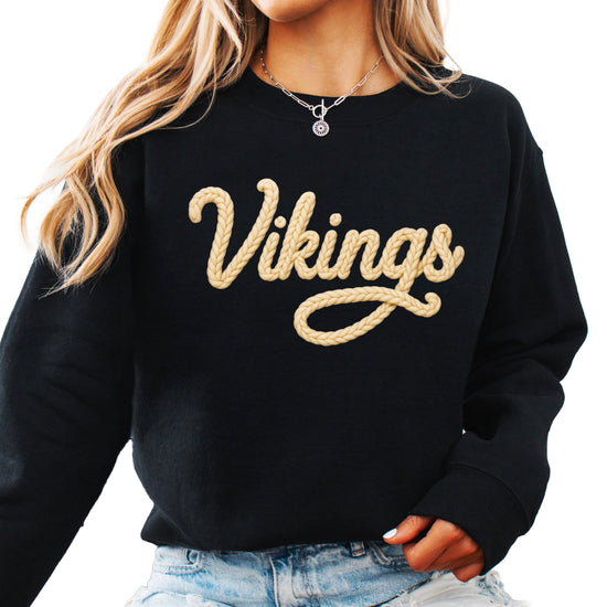 Vikings yarn script school spirit crewneck sweatshirt in Black, front view