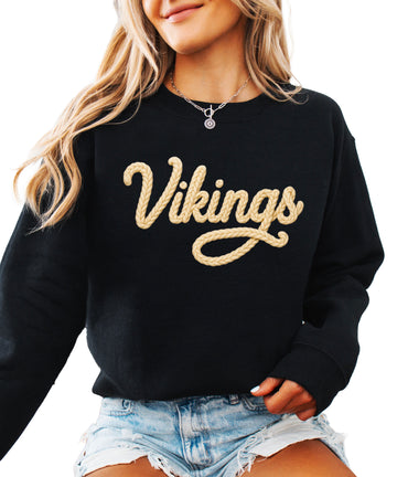 Vikings yarn script school spirit crewneck sweatshirt in Black, front view