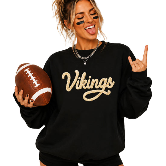 Vikings yarn script school spirit crewneck sweatshirt in Black, lifestyle view