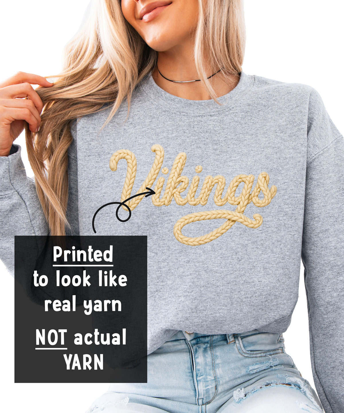 Close-up of the ink-printed Vikings yarn-look script lettering on the school spirit sweatshirt