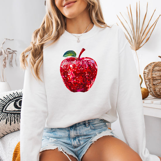 Red disco apple teacher sweatshirt, white sweatshirt, lifestyle view