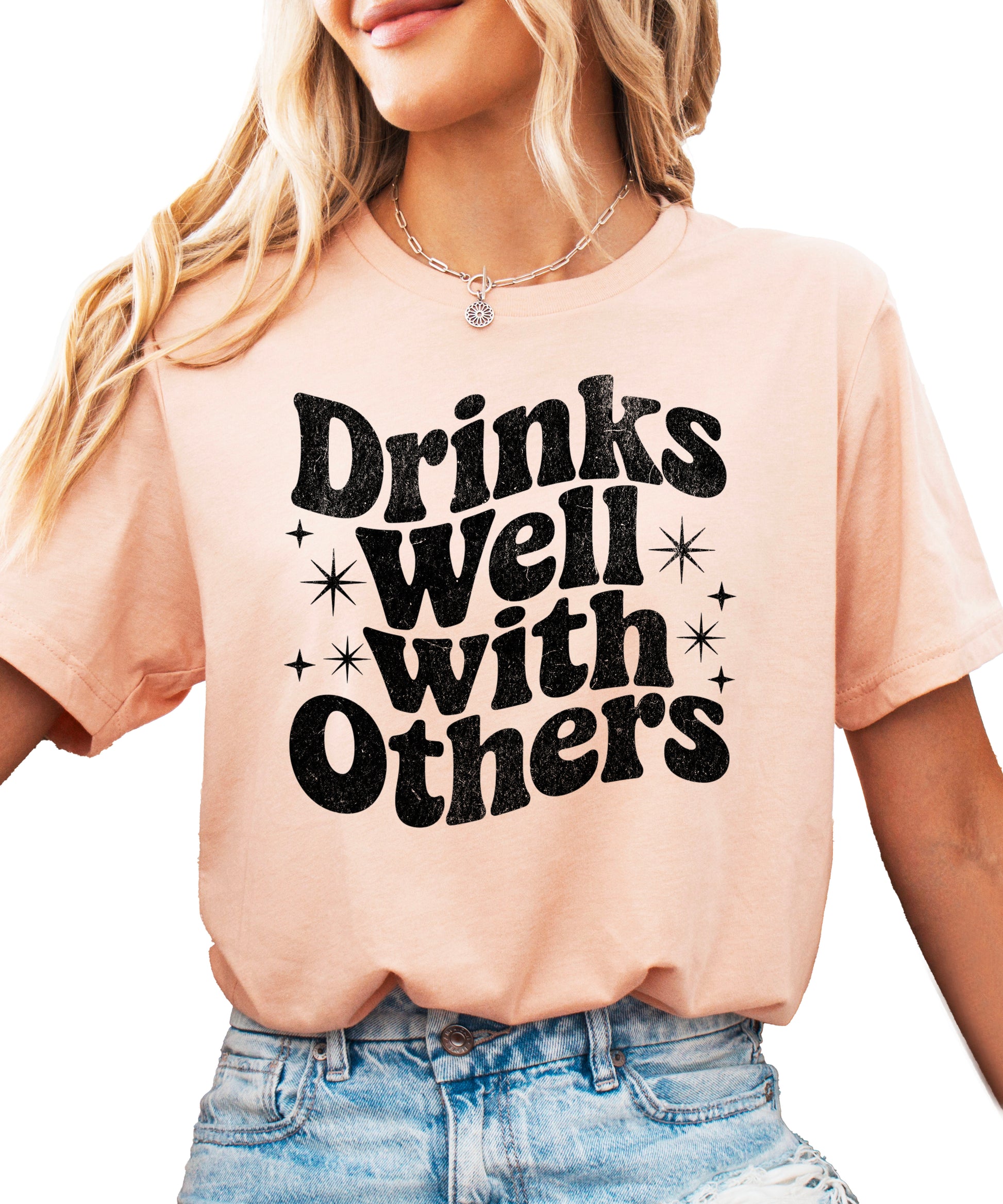 Drinks Well With Others funny graphic tee for women in Peach, front view