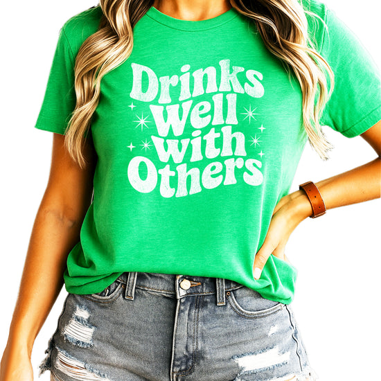 Drinks Well With Others funny graphic tee for women in Vintage Green, front view