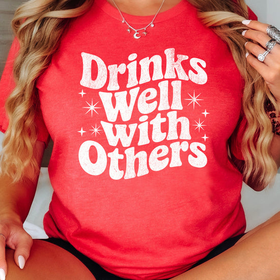 Drinks Well With Others funny graphic tee for women in Vintage Red, back view